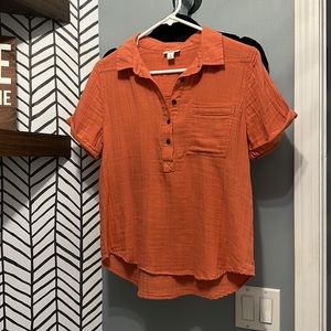 a.n.a Top with front pocket. Orange side Small